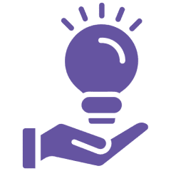 Hand holding a glowing purple lightbulb.