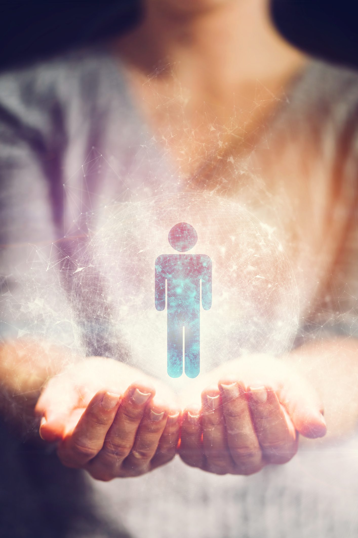 Human symbol in a hologram in woman's hands. Social media, society and business concept.