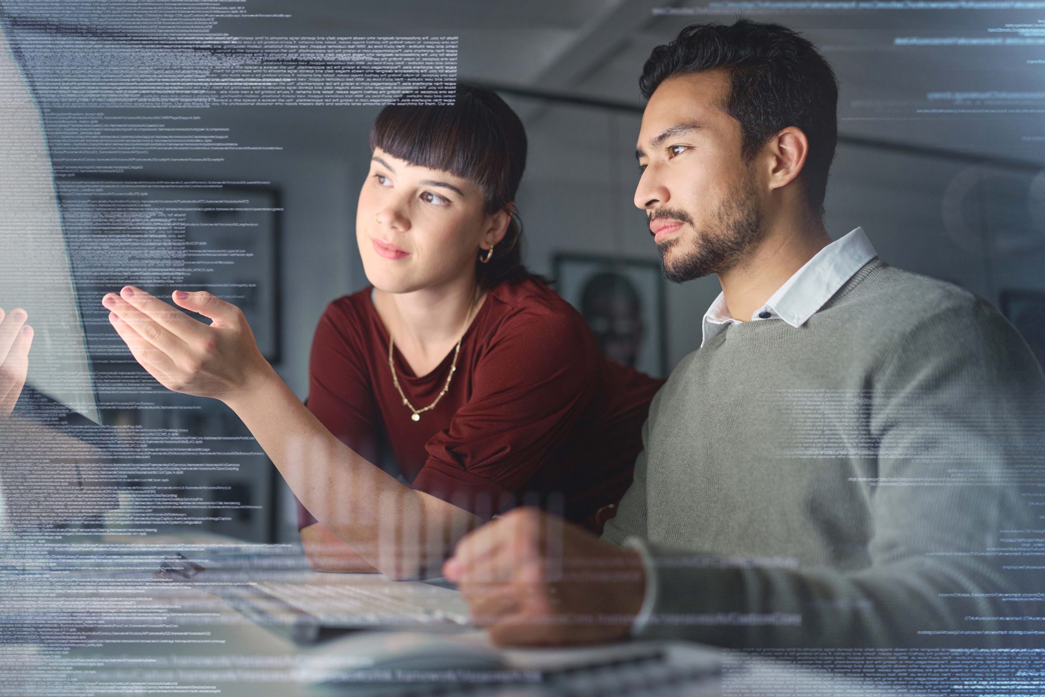 Code, manager help employee and programming with hologram, explain process and system to agent. Woman speaking to Asian man, coding and holograph with IT specialist, cyber security or cloud computing